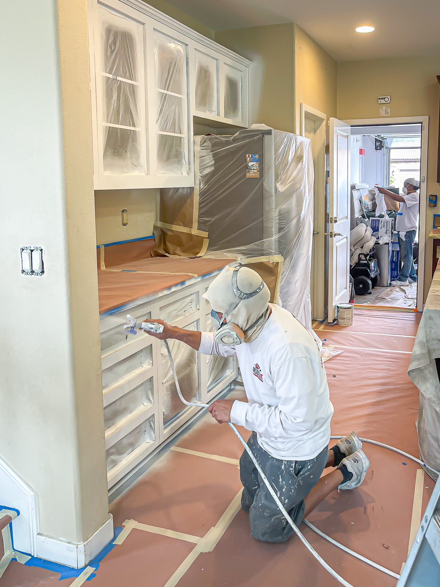 Painter preparing a home for professional painting